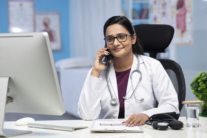 Doctor talking on telephone